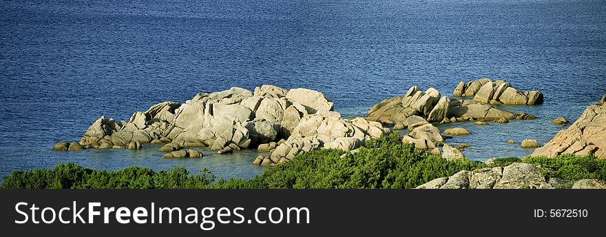 A view of sea in Sardinia with rocks. A view of sea in Sardinia with rocks.