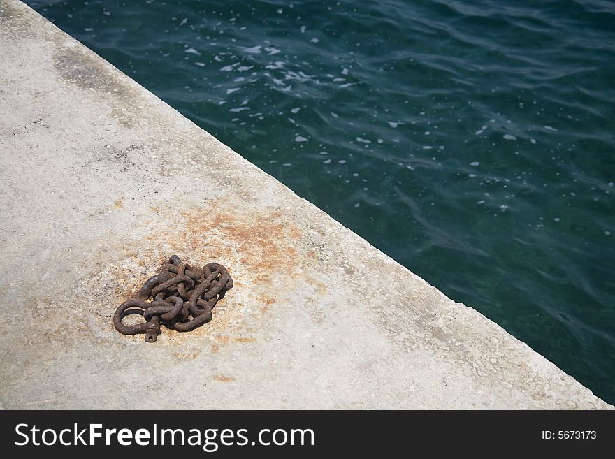 Detail of harbor with water and chain