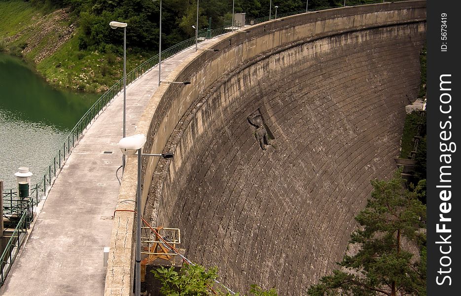 A dam built in the hills near Genoa (Italy) with its lake. A dam built in the hills near Genoa (Italy) with its lake