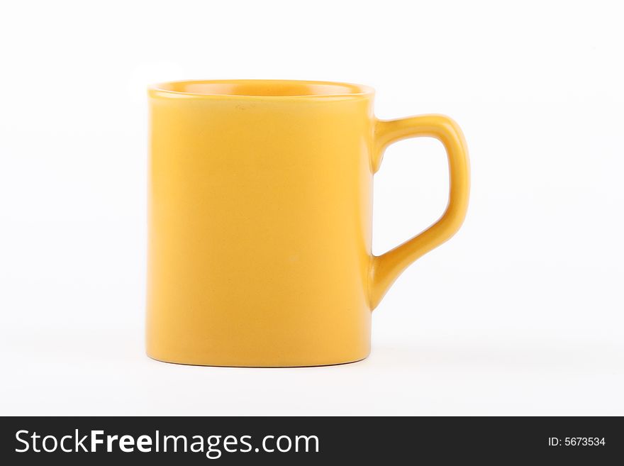 Yellow mug on a white background