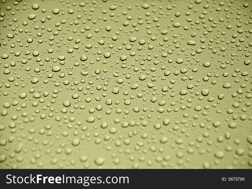 Rain drops on glass window (yellow background). Rain drops on glass window (yellow background)