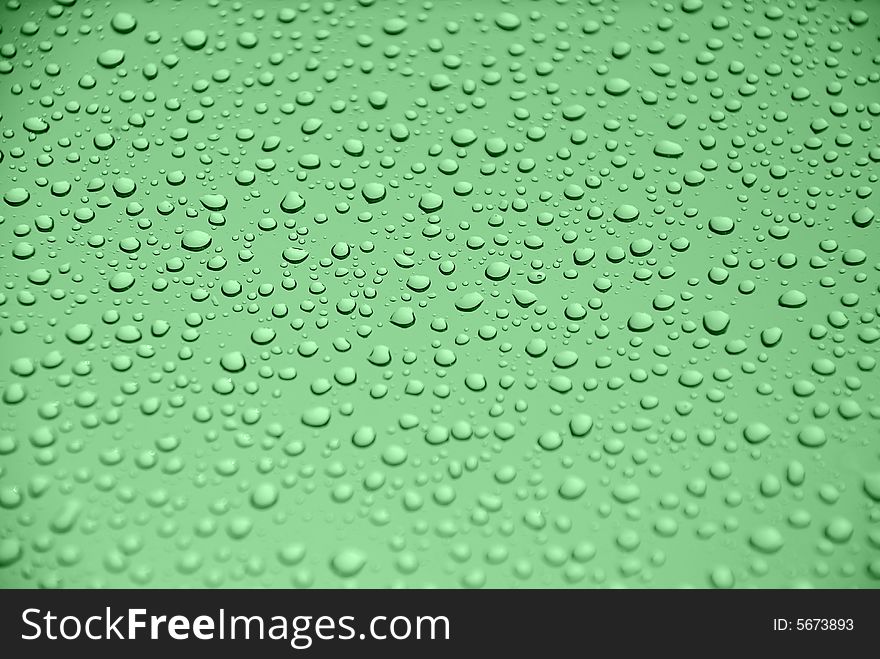 Rain drops on glass window (green background). Rain drops on glass window (green background)