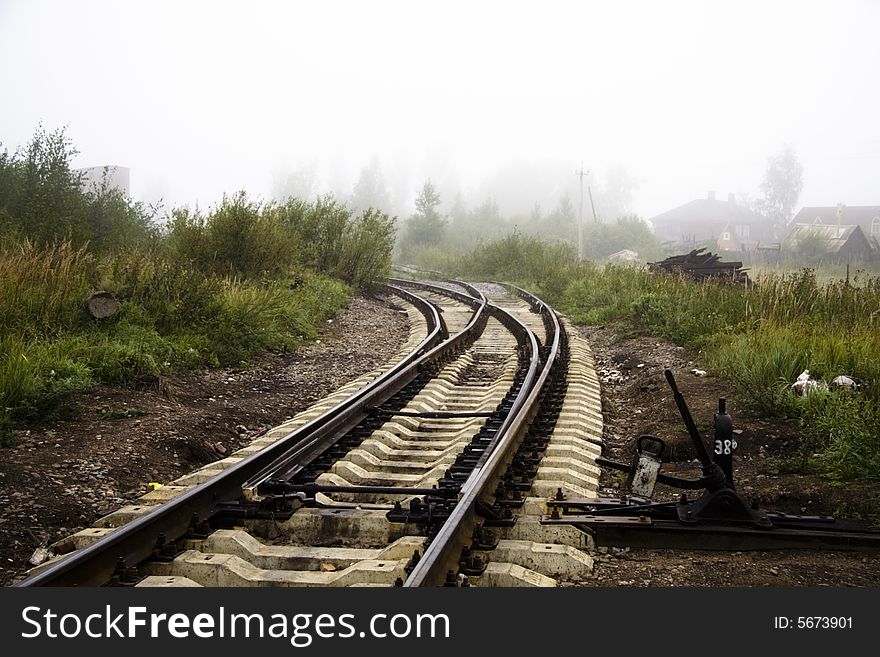 Misterious railway and green grass