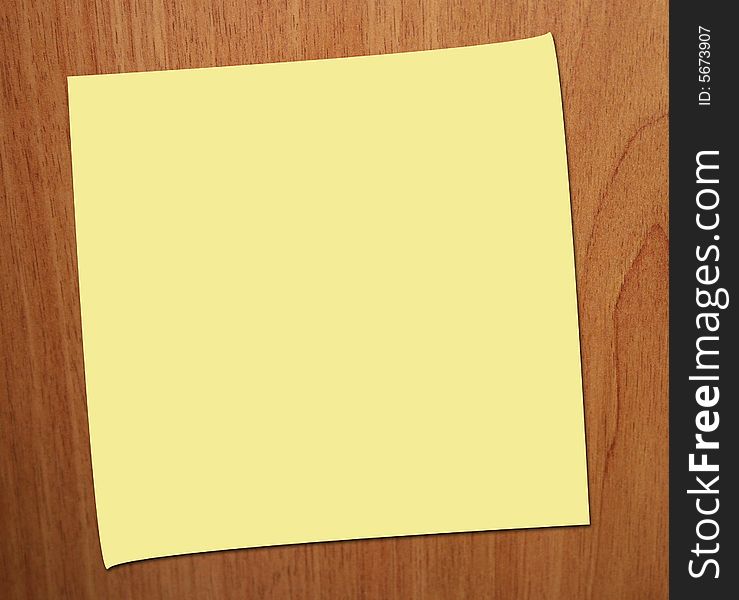 POST IT NOTE ON WOOD BACKGROUND