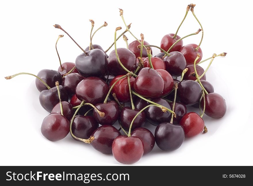 Red cherries on white background