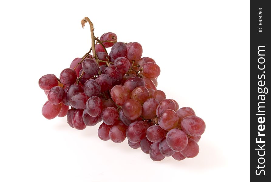 Branch of red grape on white ground