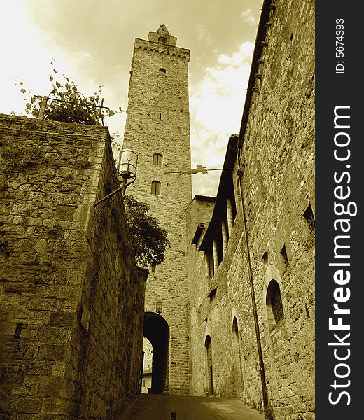 A suggestive shot of the bell tower of the cathedral in San Gimignano - Siena. A suggestive shot of the bell tower of the cathedral in San Gimignano - Siena