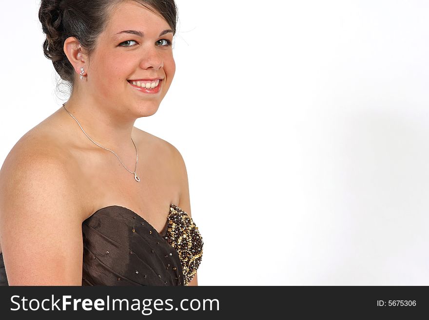 A beautiful smiling young woman dressed up for a special occasion with room for copy.