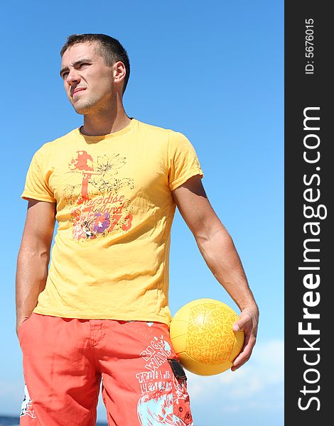 Pretty guy with yellow ball. Pretty guy with yellow ball