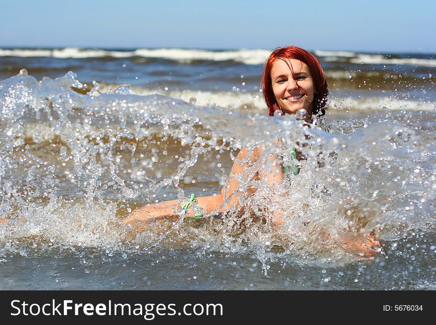 Happy young girl having fun on the sea. Happy young girl having fun on the sea
