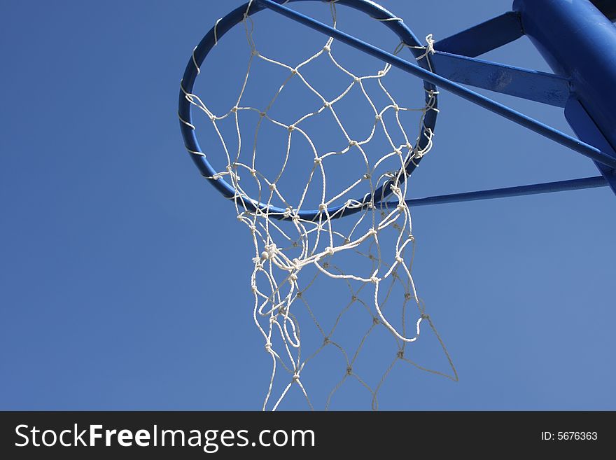 Basketball hoop in the blue sky. Basketball hoop in the blue sky.