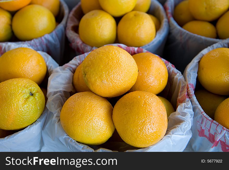 An image of large oranges at a fresh farmer's market. An image of large oranges at a fresh farmer's market