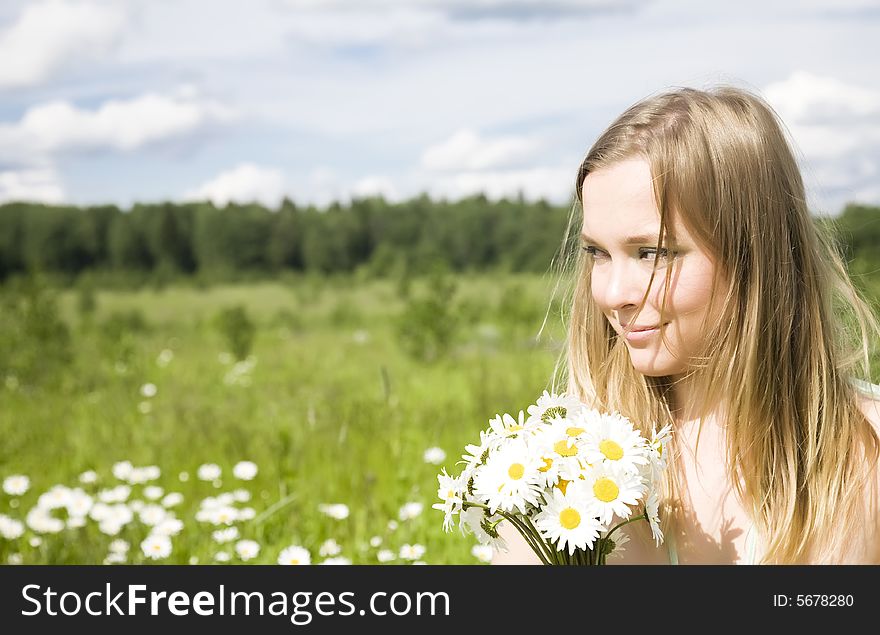 Smiling Woman With Flowers Outdoors