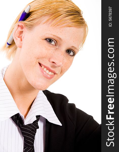 Young business woman is waiting with a pen on her ear. Young business woman is waiting with a pen on her ear