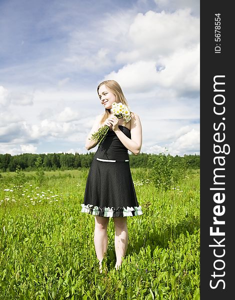 Young Woman With Flowers Outdoors