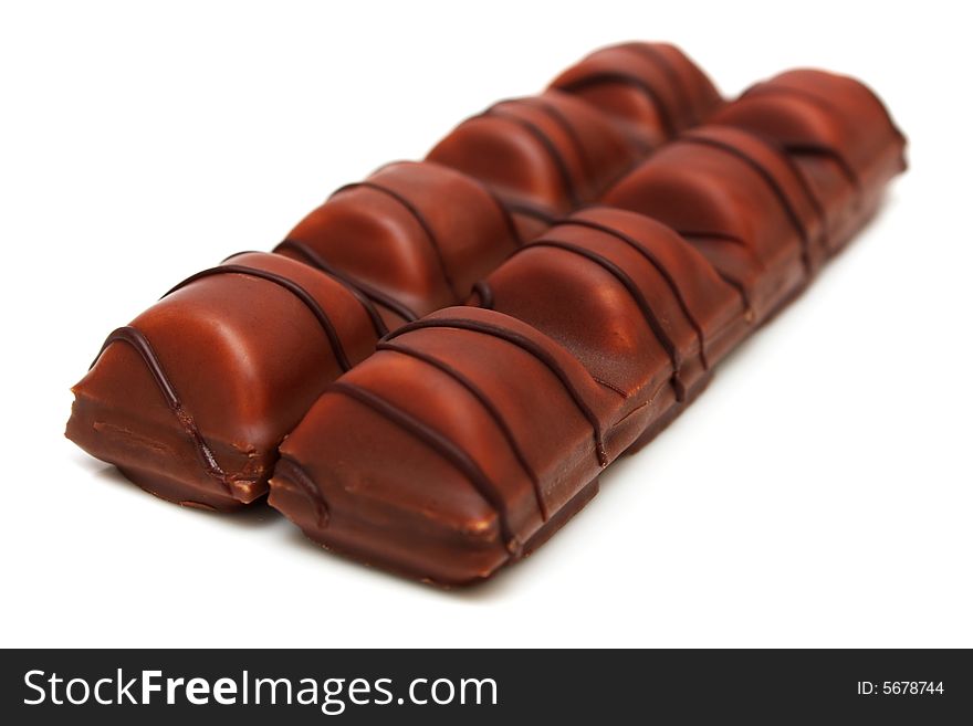 Milk chocolate bars covered wafer on white background.