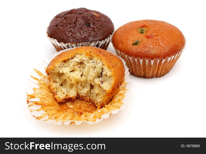 Three different flavor muffins put together on white background.