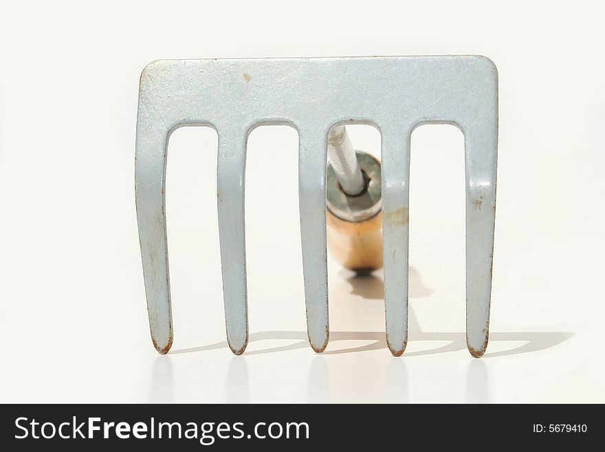 Hand rake against white background