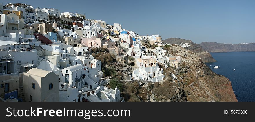 Vibrant cliff-top village in Greece. Vibrant cliff-top village in Greece.