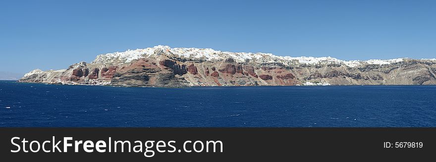 Classic Mediterranean seascape with cliff-top village. Classic Mediterranean seascape with cliff-top village.