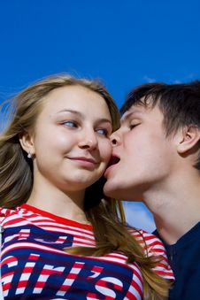 Kissing Couple On A Background Of The Blue Sky Royalty Free Stock Images