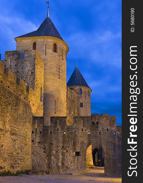 The towers of Carcassonne's medieval walls are illuminated as dusk falls. The towers of Carcassonne's medieval walls are illuminated as dusk falls.