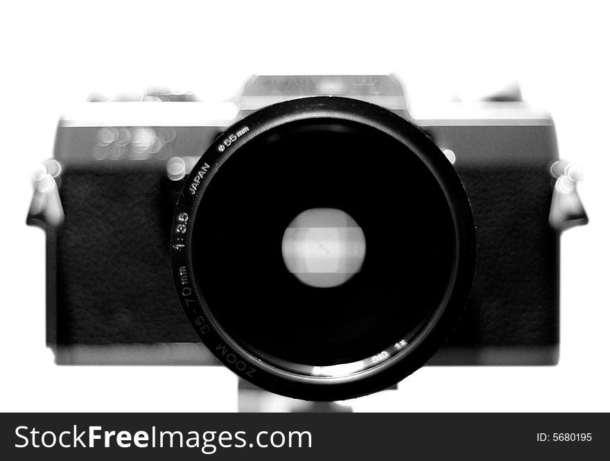 Front view of a film Single Lens Reflex (SLR) camera. Front view of a film Single Lens Reflex (SLR) camera.