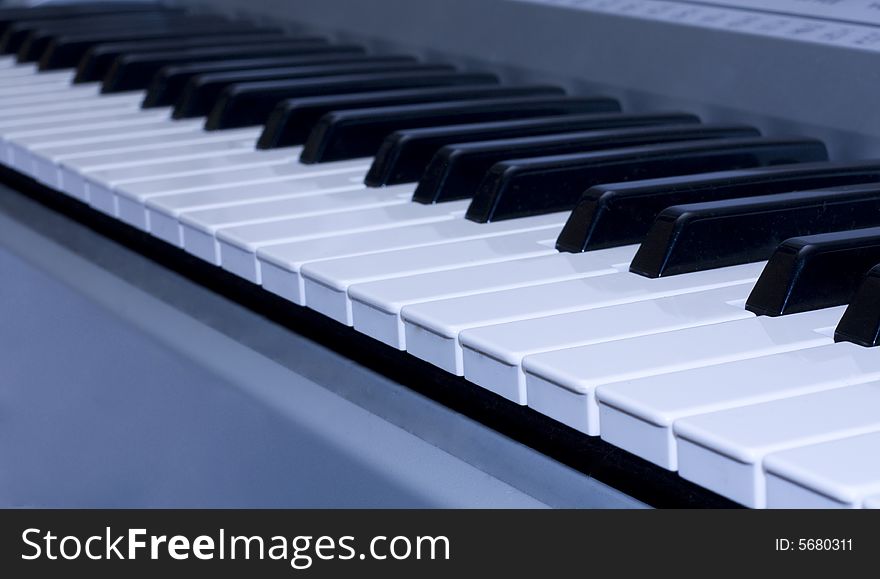 Piano keyboard on blue background