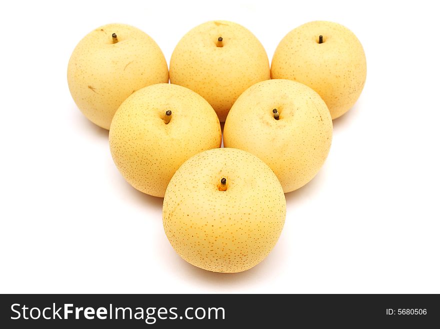 Six nashi pears arranged in triangle shape on white background.