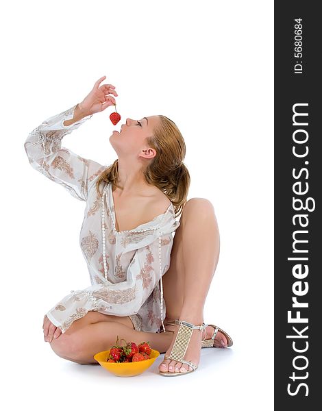 Beautiful girl with strawberry over white