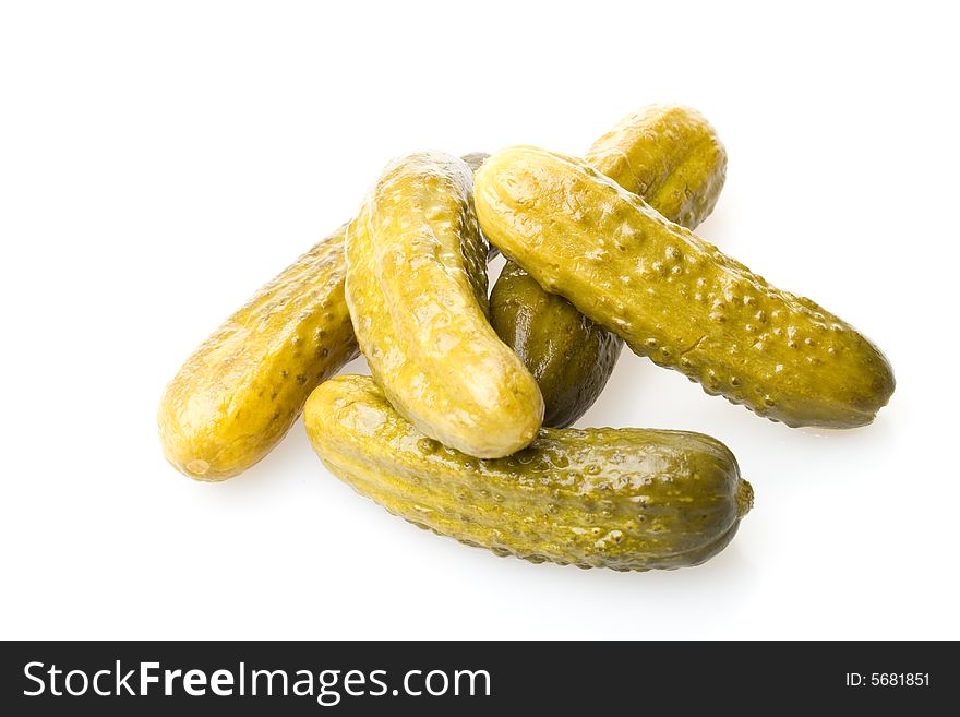 Crackling pickled gherkins on a white background