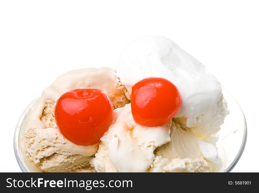 Ice-cream with a cherry in a glass on a white background. Ice-cream with a cherry in a glass on a white background.