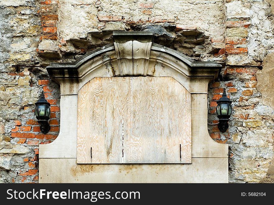 An image of wooden window closed on wall