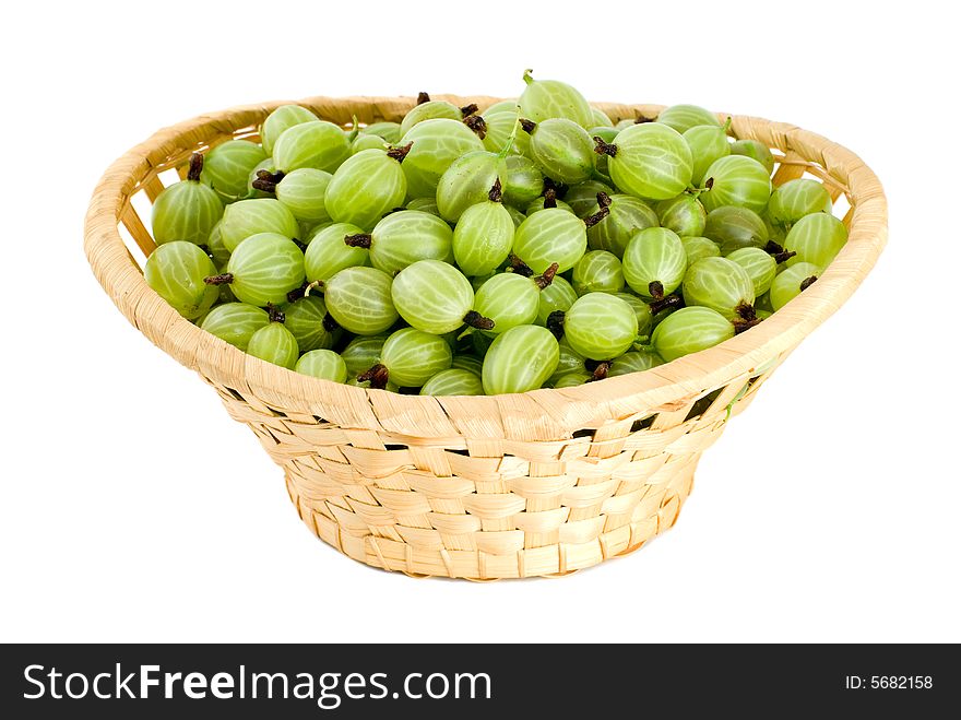 Gooseberries in the wicker basket isolated on the white background