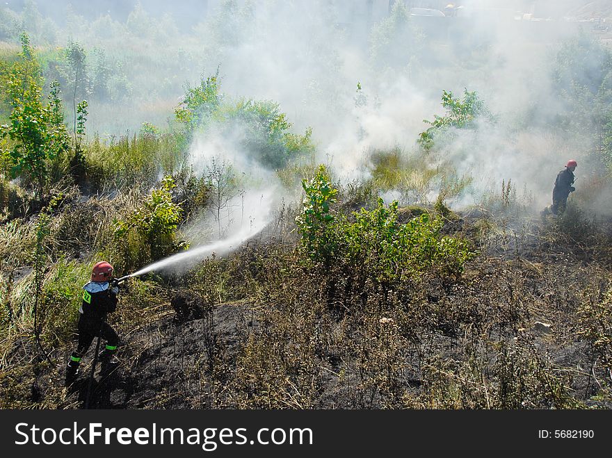 Fireman Fighting A Heath Fire