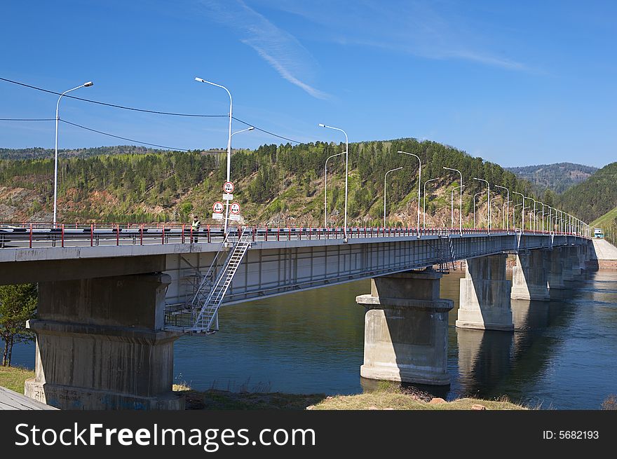 Bridge on the river in siberia