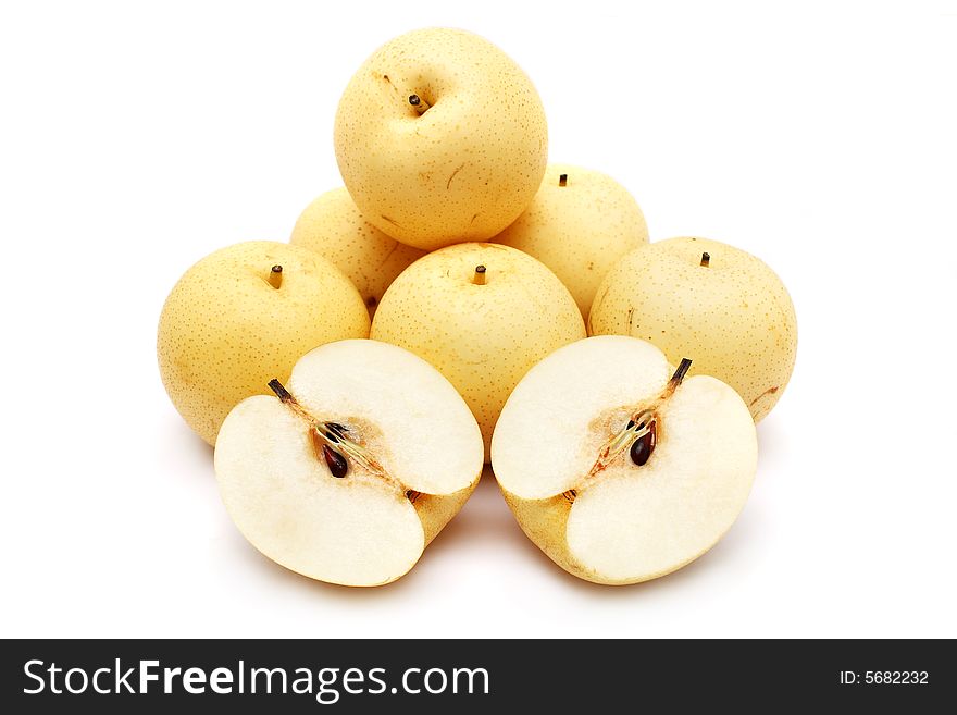 Nashi pear sliced into half stacked with others white background. Nashi pear sliced into half stacked with others white background.