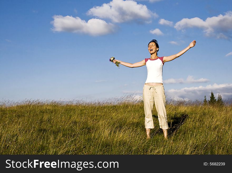Young woman enjoying summer field. Young woman enjoying summer field