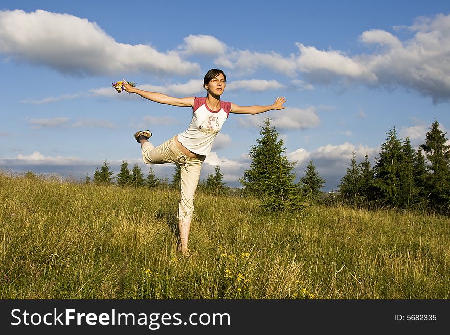 Young woman doing yoga outdoors. Young woman doing yoga outdoors