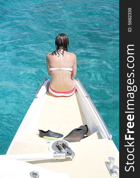 Girl in red white bikini on the boat. Girl in red white bikini on the boat