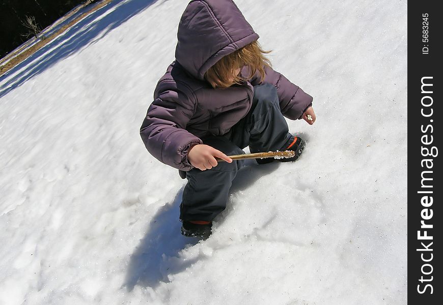 Child Playing In The Snow