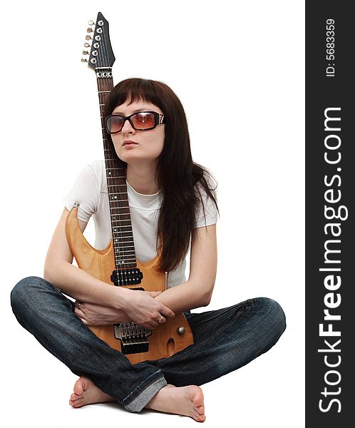 Pretty girl holding an electric guitar isolated on white background