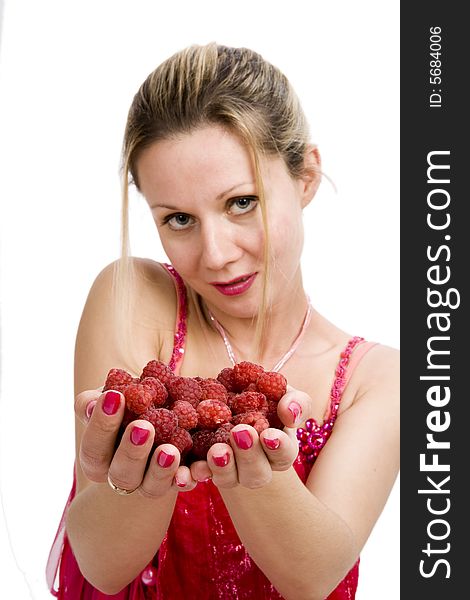 Long hair blonde woman in red with whole  palms of raspberries. Long hair blonde woman in red with whole  palms of raspberries
