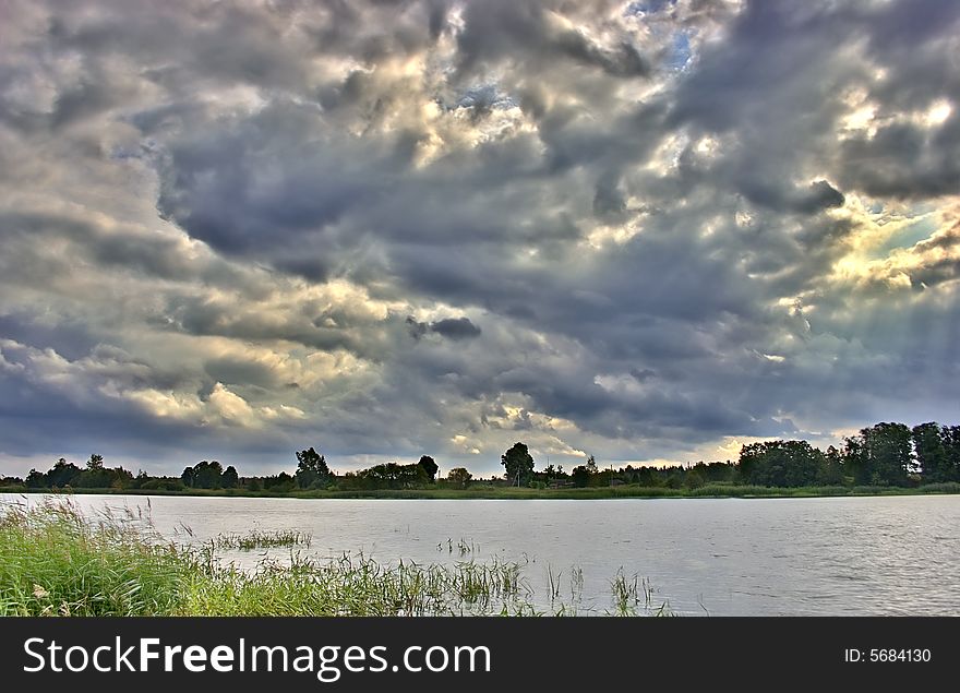 Sky with dark clouds above river. Sky with dark clouds above river
