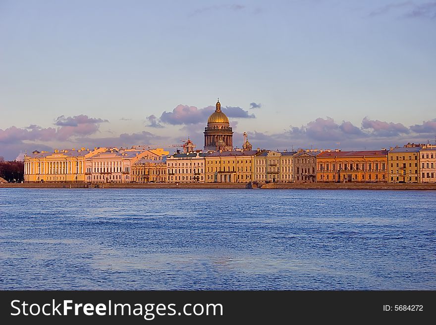 Sunset above Neva river and Isaak cathedral in Saint-Petersburg