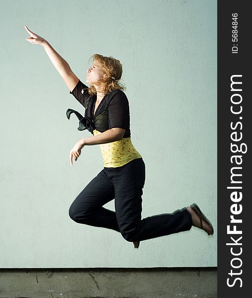 Jumping girl against the wall. Jumping girl against the wall.