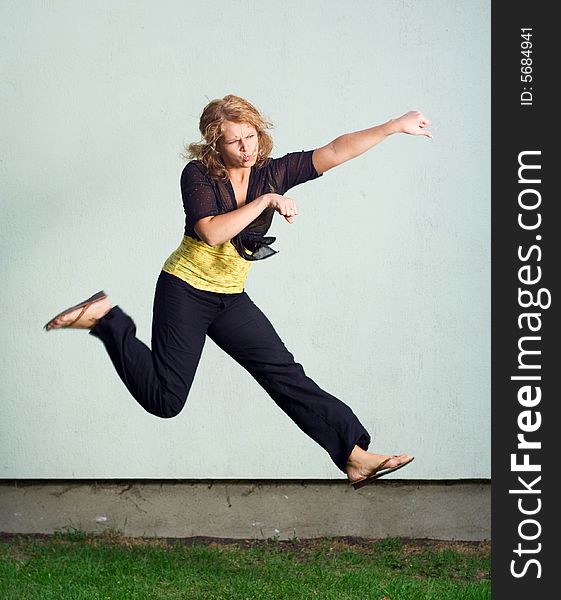 Jumping girl against the wall. Jumping girl against the wall.