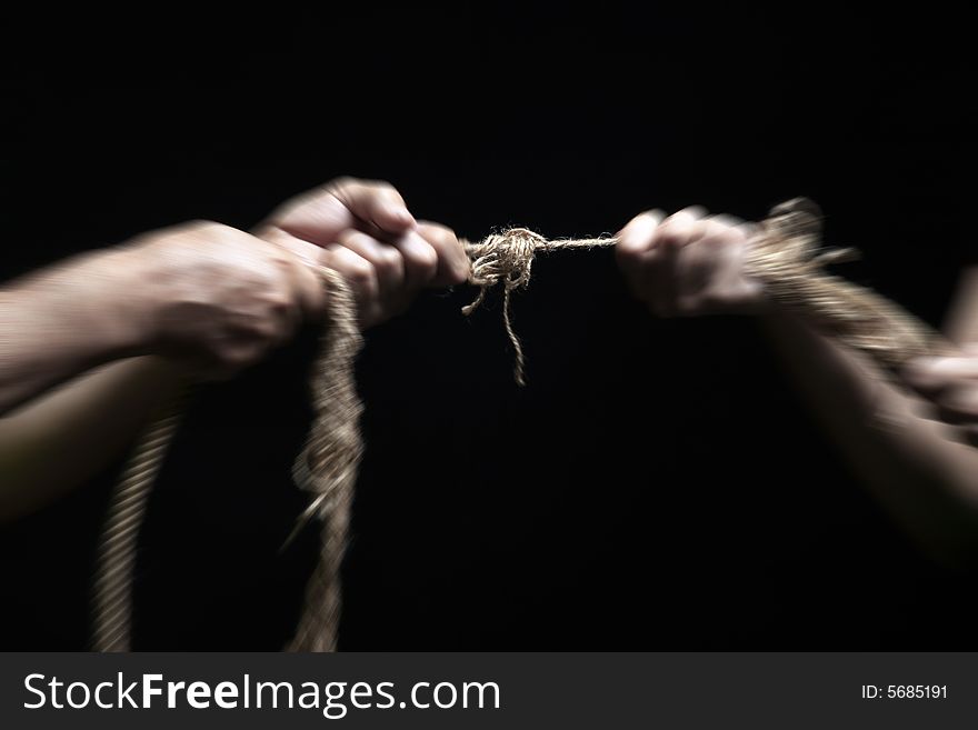Photo of a rope with hand pulling