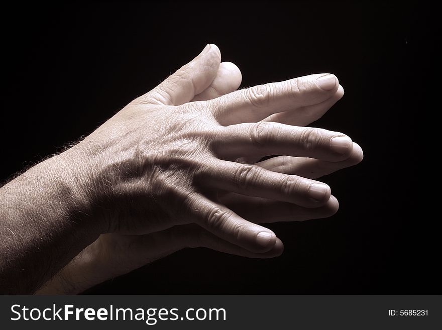 Photo of an old male hands on black. Photo of an old male hands on black