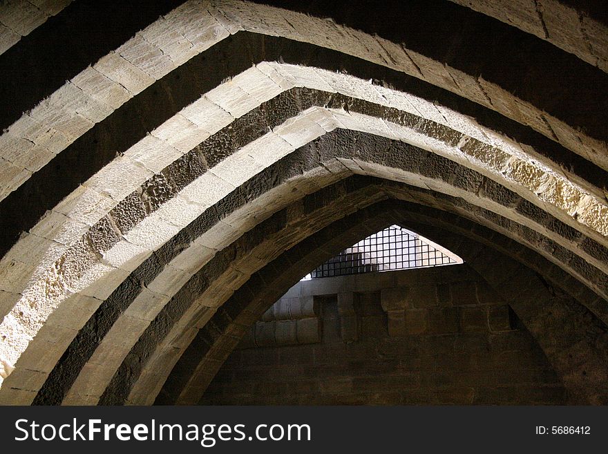 Arches in a crypt in a church in Olite, Navarra, Spain